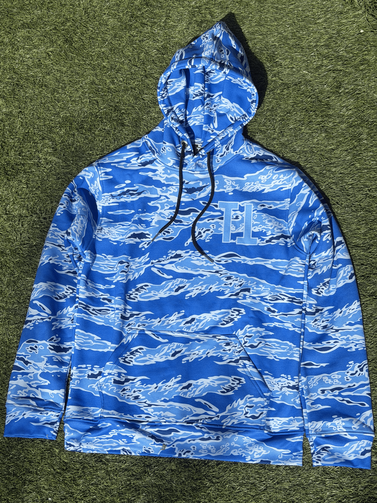 Tiger Camo Blue Shark Hoodie, front view, outdoors on grass