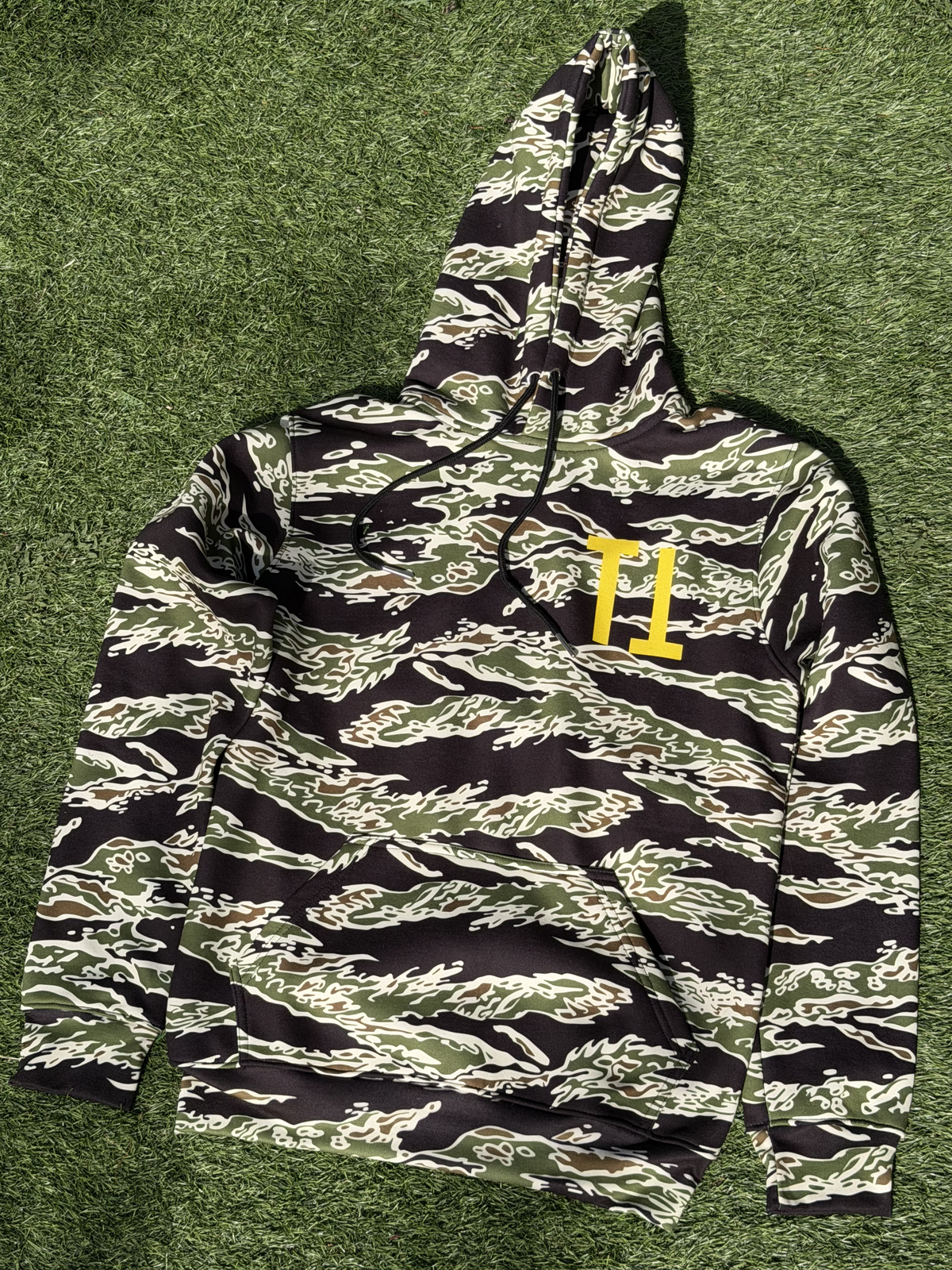 Tiger Camo Yellow Shark Hoodie, front view, outdoors on grass