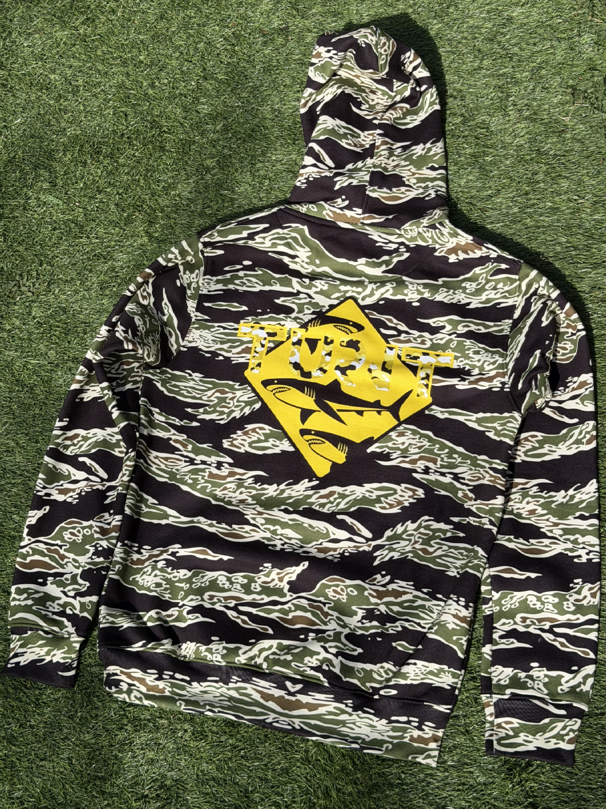 Tiger Camo Yellow Shark Hoodie, alternate front view, outdoors on grass
